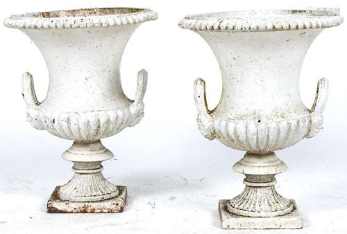 A pair of cast iron campana shaped two handled garden vases,...