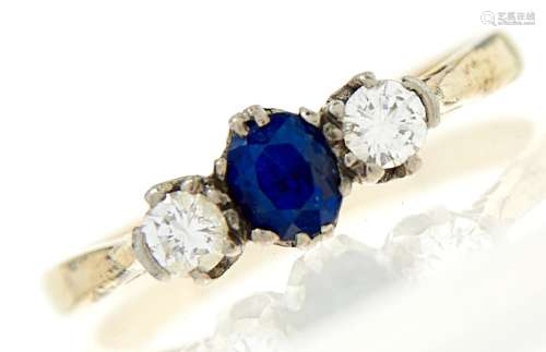 A sapphire and diamond ring, the cushion shaped sapphire fla...