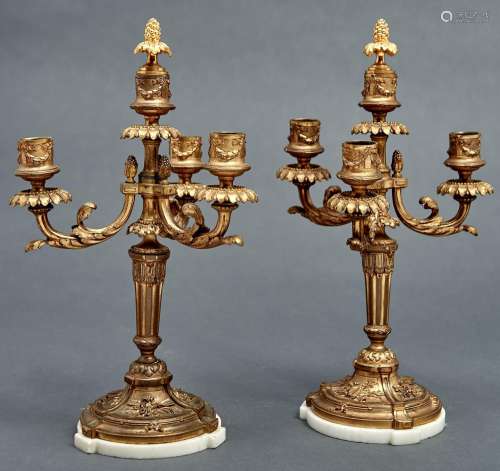 A pair of French ormolu candelabra, early 20th c, in Louis X...