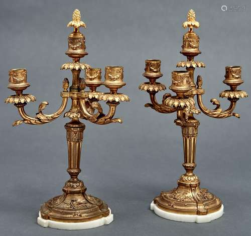 A pair of French ormolu candelabra, early 20th c, in Louis X...