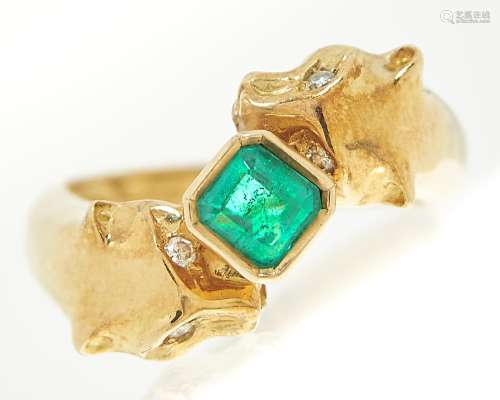 An emerald and diamond 'big cats' ring, the step cut emerald...
