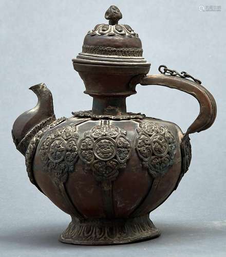 A Tibetan copper teapot and cover, 19th / early 20th c, appl...