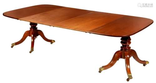 A twin pillar mahogany dining table, 19th c and later, the o...
