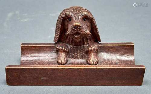 A Swiss carved and stained limewood dog's head novelty inkwe...