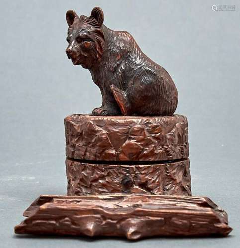 A Swiss carved and stained limewood bear novelty inkwell, c1...
