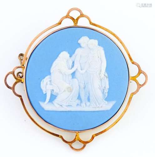 A Wedgwood Jasper cameo, late 19th c, sprigged with three cl...