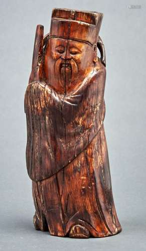 A Chinese stained ivory carving of an immortal, Qing dynasty...