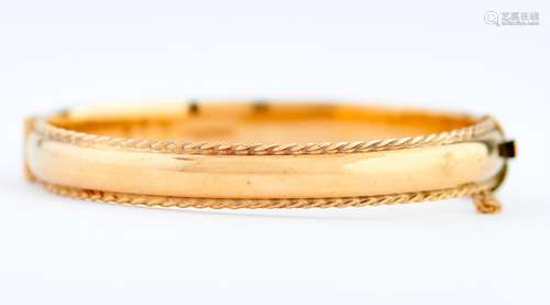 A 9ct gold bangle, 67mm, Birmingham 1991, 17g Slightly scrat...