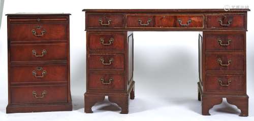 A reproduction mahogany desk in George III style, the rectan...