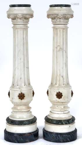 A pair of marble torcheres, 20th c, the flued statuary marbl...
