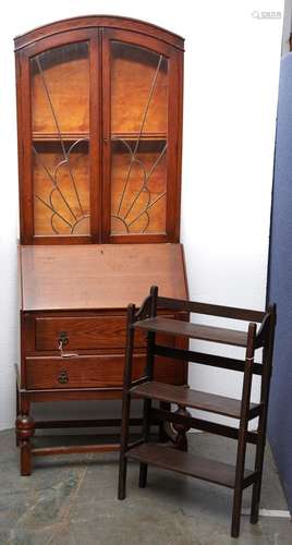 An oak bureau bookcase in Art Deco style, c1950, the arched ...