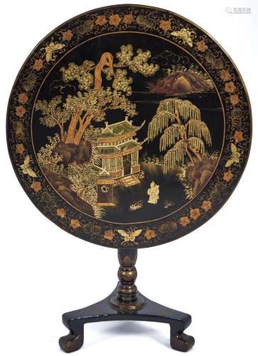 A Chinese black and gold lacquer table, late 19th c, the rou...
