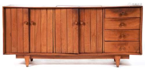 A mid century ash sideboard, c1960, the top with flush lidde...