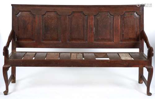 A George III oak settle, late 18th c, the slightly raked bac...