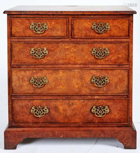 A walnut and burr walnut chest of drawers, late 20th c, in G...