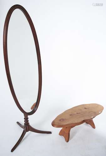 An adjustable oval mahogany cheval mirror on tripod, late 20...