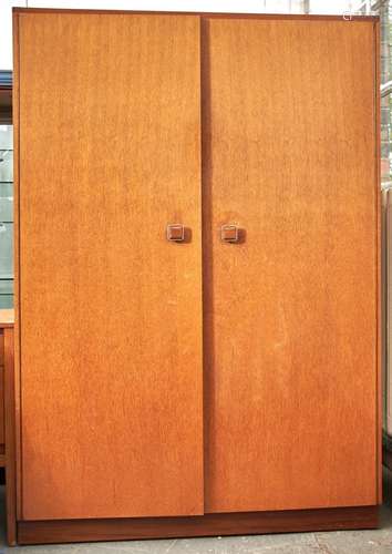 An oak bedroom suite, c1960's, comprising gentleman and lady...