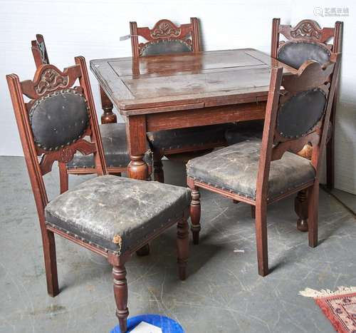 An oak draw leaf dining table on turned legs and a set of fo...