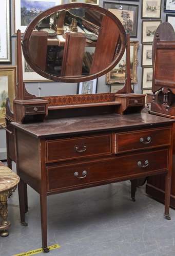 A Victorian walnut dressing table, the central bevelled plat...