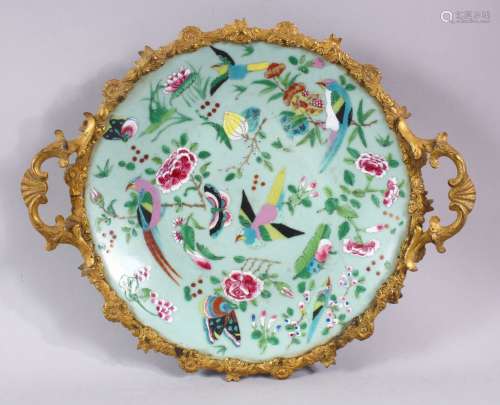 A CHINESE CELEDON CIRCULAR DISH, painted with birds and flow...