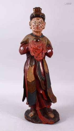 A CHINESE WOOD & LACQUER FIGURE, the figure stood holding a ...