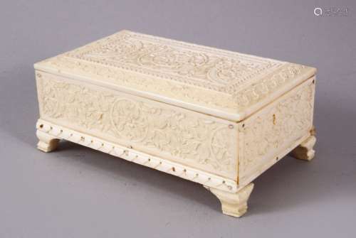 A 19TH CENTURY INDIAN MUGHAL CARVED IVORY LIDDED BOX, carved...