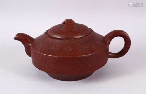 A CHINESE YIXING CLAY CALLIGRAPHIC TEAPOT, the body of the p...