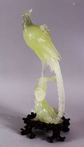 A CHINESE CARVED JADE FIGURE OF A PHOENIX BIRD - stood upon ...
