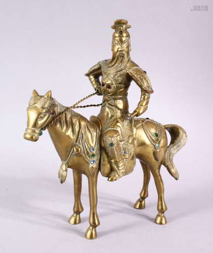 A GOOD CHINESE GILT BRONZE FIGURE OF A WARRIOR ON A HORSE, 2...