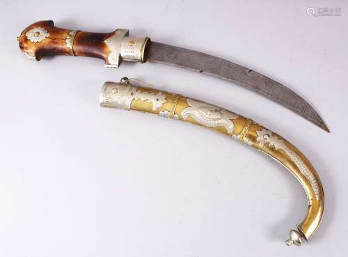 A LARGE SAUDI ARABIA JAMBIYA DAGGER, With a carved wooden ha...