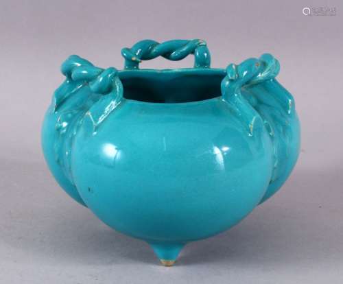 A CHINESE TURQUOISE GLAZED TRIPLE FOOT PORCELAIN CENSER, wit...
