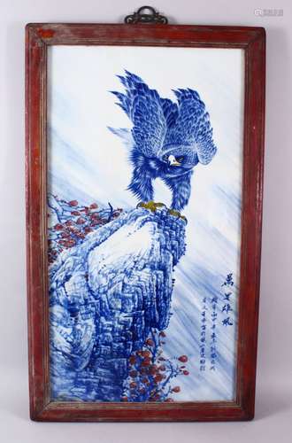 A CHINESE BLUE, WHITE & COPPER RED PORCELAIN PANEL OF A HAWK...