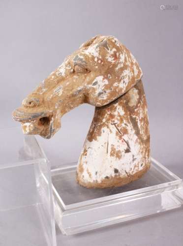 AN EARLY CHINESE HAN DYNASTY POTTERY HORSE HEAD BUST, the fi...