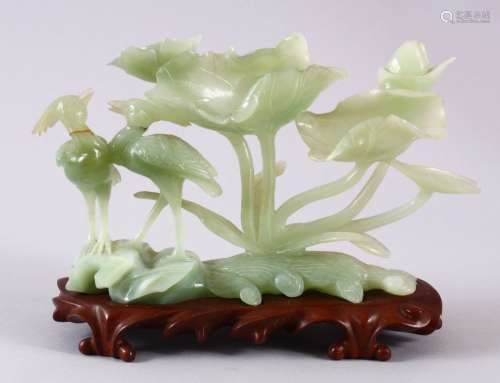 A CHINESE 20TH CENTURY CARVED JADE FIGURE & STAND, the figur...