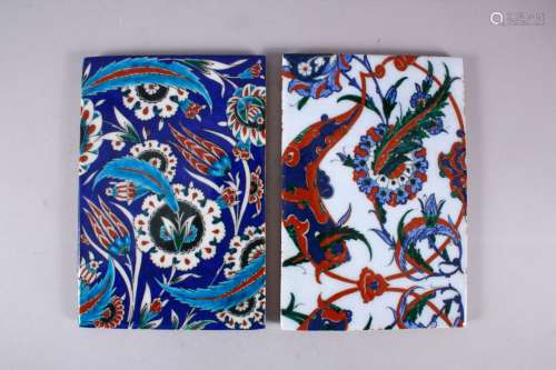 TWO GOOD IZNIK STYLE POTTERY TILE SECTIONS, one with a blue ...