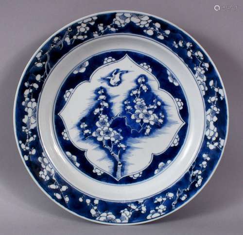 A FINE QUALITY CHINESE KANGXI PERIOD BLUE AND WHITE BIRD AND...