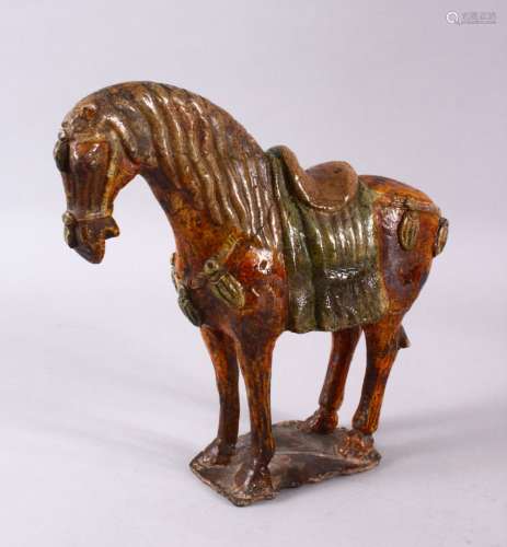 A CHINESE MING SANCAI GLAZED POTTERY HORSE, 24cm
