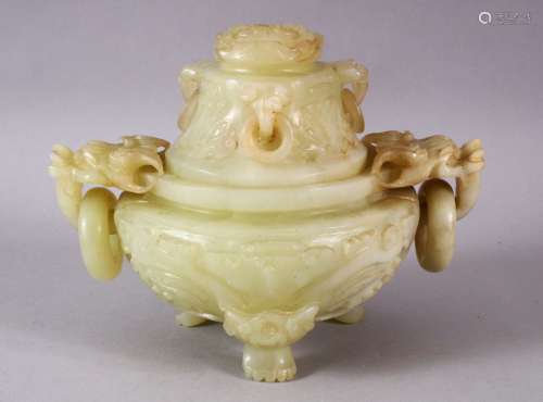 A CHINESE CARVED JADE TRIPD LIDDED CENSER, carved with lion ...
