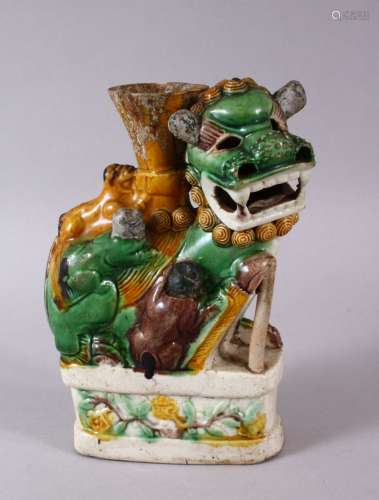 A CHINESE FAMILLE VERTE POTTERY LION DOG FIGURE, with boys c...