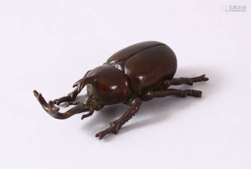 A JAPANESE BRONZE FIGURE OF A LONG MOUTH BEETLE - the base w...