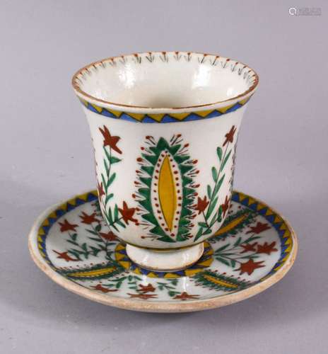 18TH CENTURY TURKISH KUTHAYA POTTERY CUP AND SAUCER, decorat...