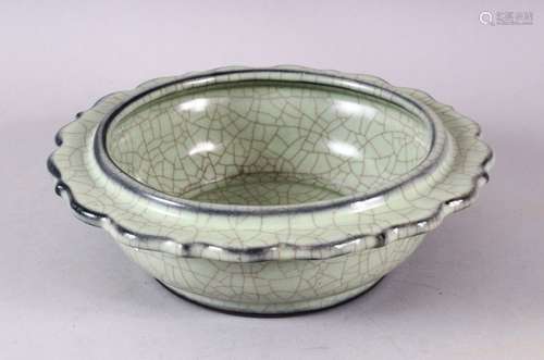 A CHINESE BARBED RIM GUAN GLAZED POTTERY DISH, the flared ri...