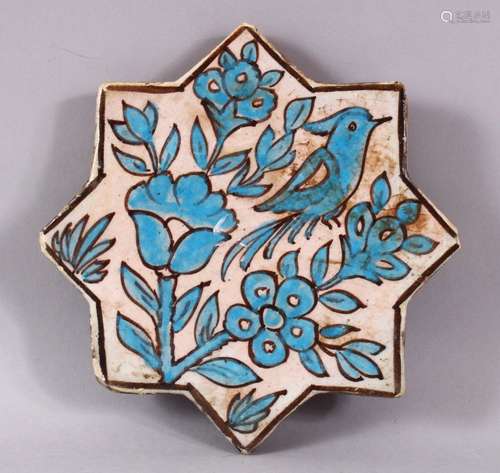 AN IRANIAN TURQUOISE GLAZE STAR FORMED POTTERY TILE, decorat...