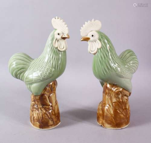 A PAIR OF CHINESE CELADON GLADE PORCELAIN MODEL CHICKENS, ea...