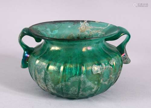 A RARE EARLY ISLAMIC OR ROMAN BLUE GLASS TWIN HANDLED BOWL, ...