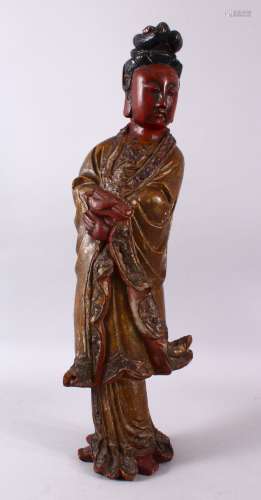 A LARGE CHINESE WOOD & LACQUER FIGURE OF GUANYIN, stood hold...