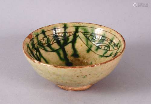 A 13TH CENTURY SMALL SCRAFFITO POTTERY BOWL, with carved bor...