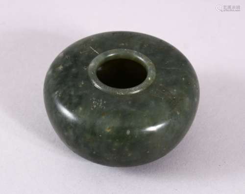 A CHINESE CARVED MOSS GREEN JADE INSCRIBED BUSH WASH, with f...