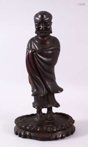 A CHINESE CARVED WOODEN FIGURE OF ROHAN, 30cm high