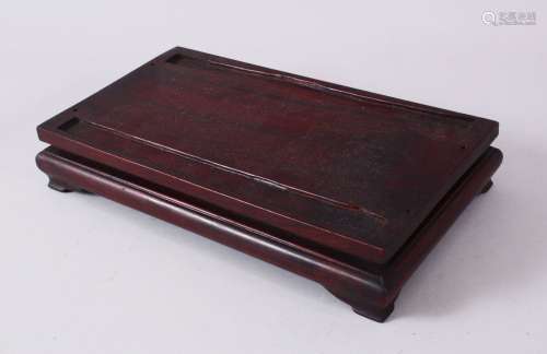 A CHINESE CARVED RECTANGULAR HARDWOOD STAND - With carved sl...